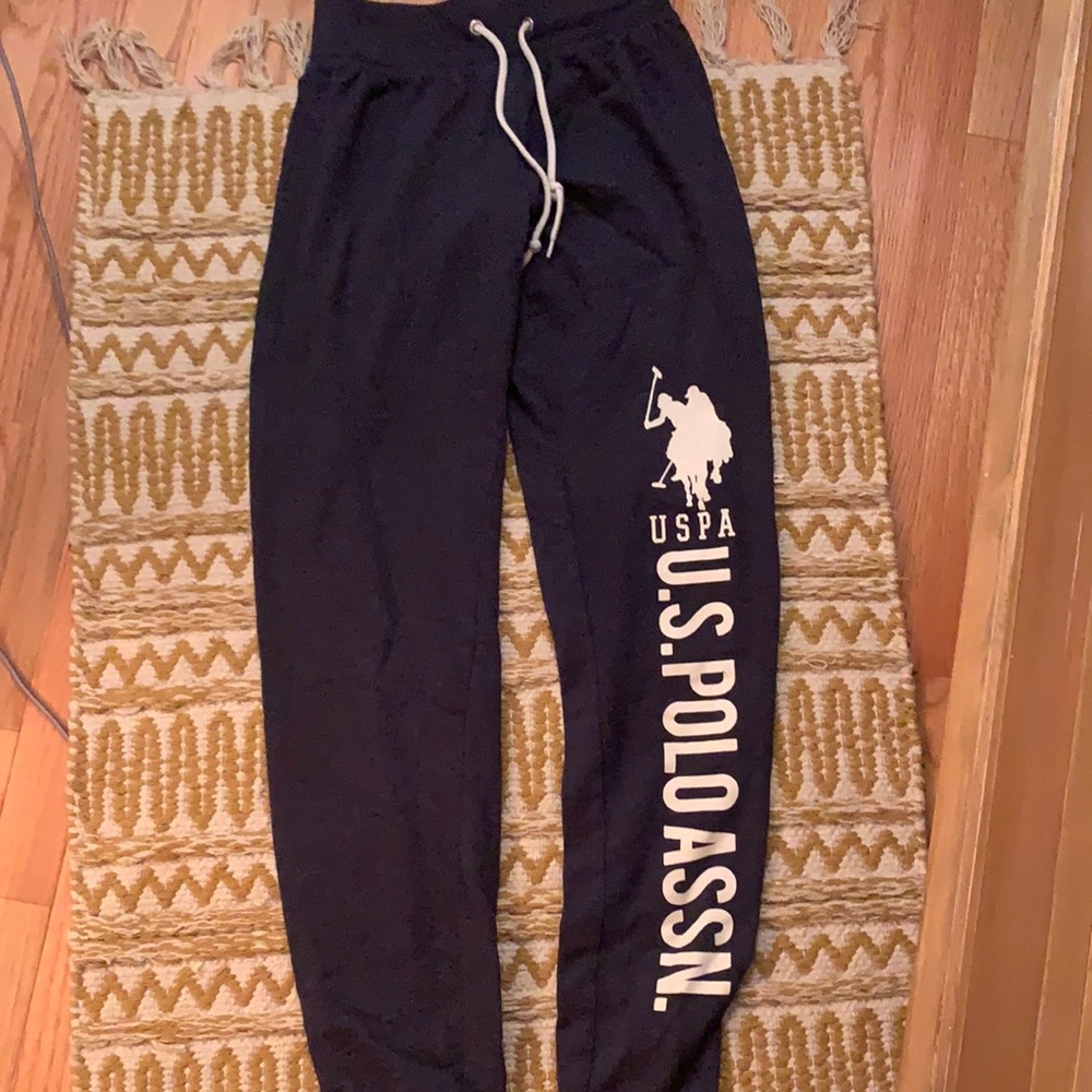 blue grey sweatpants with U.S. POLO ASSN. written on leg